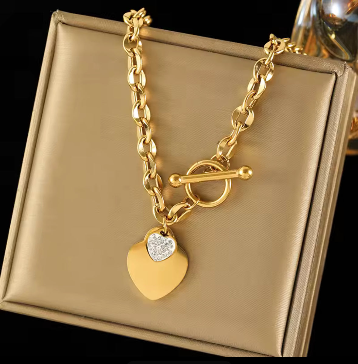 stainless steel gold double heart necklace and bracelet set.