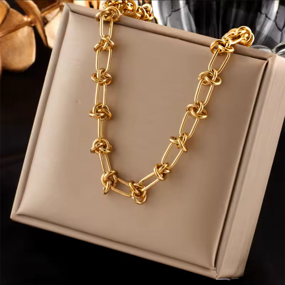 Gold twisted knot, stainless steel bracelet and necklace set.