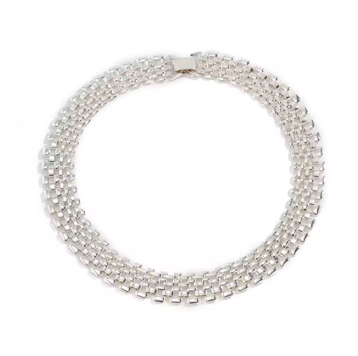 Thick silver watchband choker necklace.