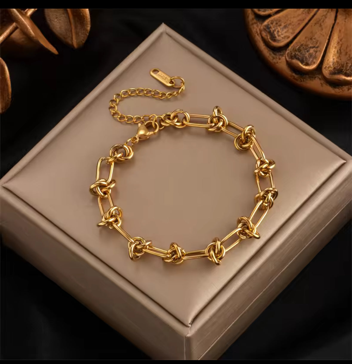 Gold twisted knot, stainless steel bracelet and necklace set.