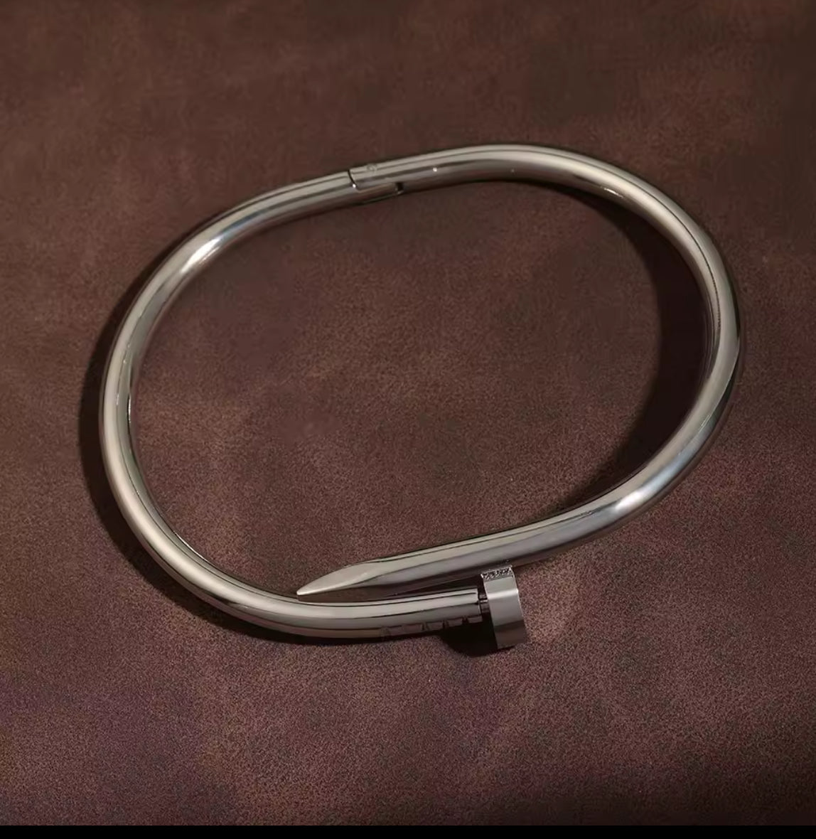 Designer-Inspired Silver Stainless Steel Nail Bracelet – Luxury Modern Bangle for Women.