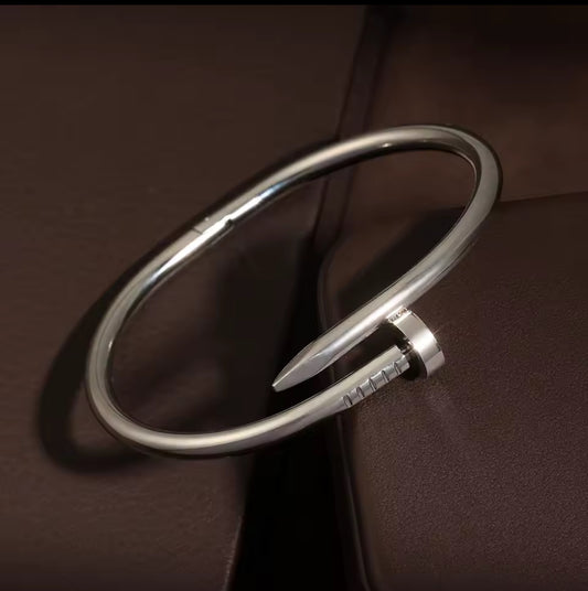 Designer-Inspired Silver Stainless Steel Nail Bracelet – Luxury Modern Bangle for Women.