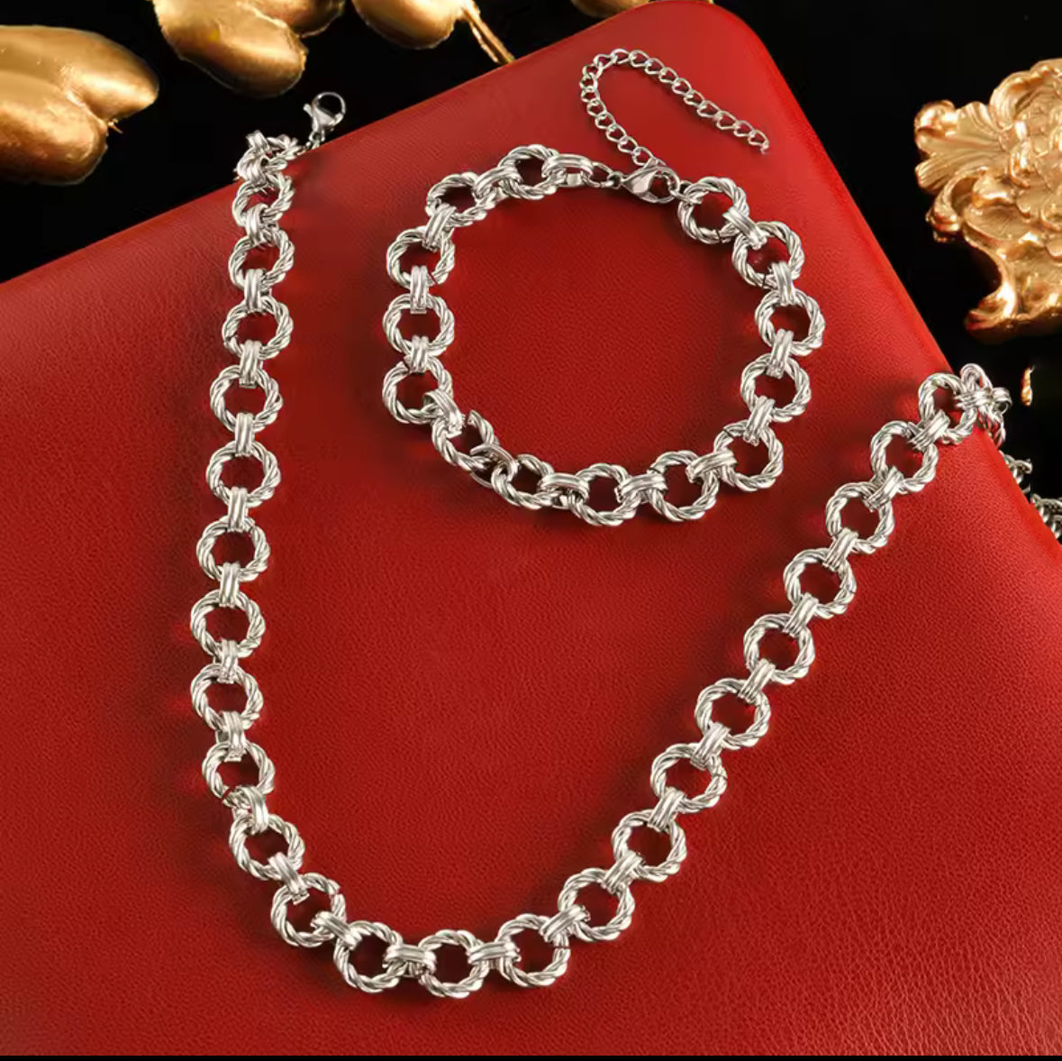 Silver stainless steel circular twisted link Necklace and bracelet set.