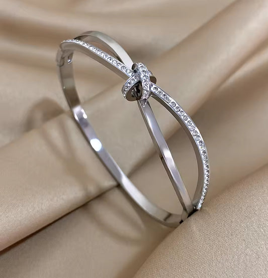 Designer Inspired  Silver Stainless Steel Twisted Knot  in laid Zircon bracelet